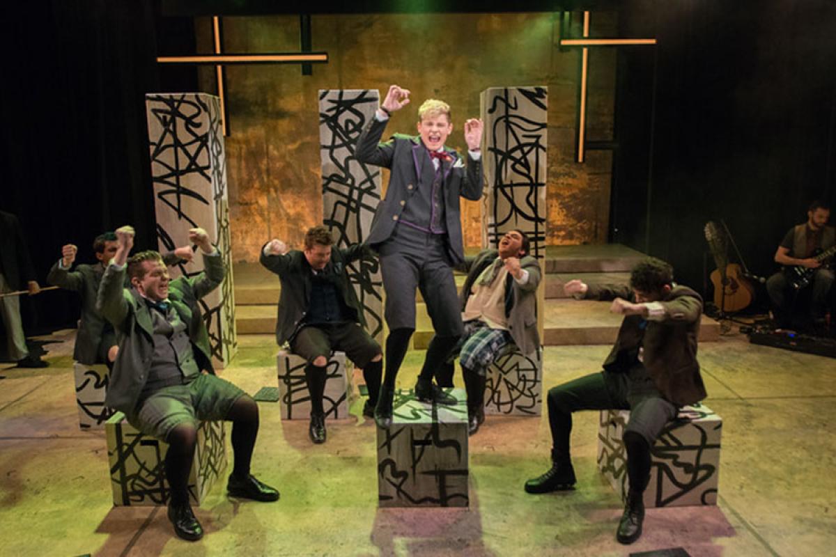 Students performing in a stage production of “Spring Awakening.”
