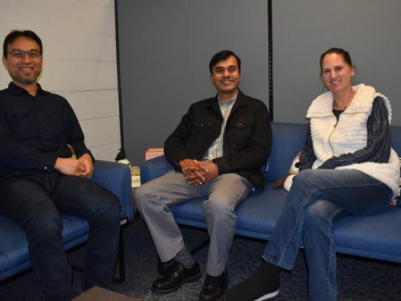 From left, Westfield State University professors Mao-Lun Weng, biology, Subramanain Vaitheeswaran, chemistry, and Kimberly Berman, biology, discuss a new STEM grant for low-income students. Not pictured is math professor Jesse Johnson.