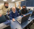 CIT lab assistants Cameron Young, and Sam Petrone help WSu faculty member Karl Leiker update his meteorology page.