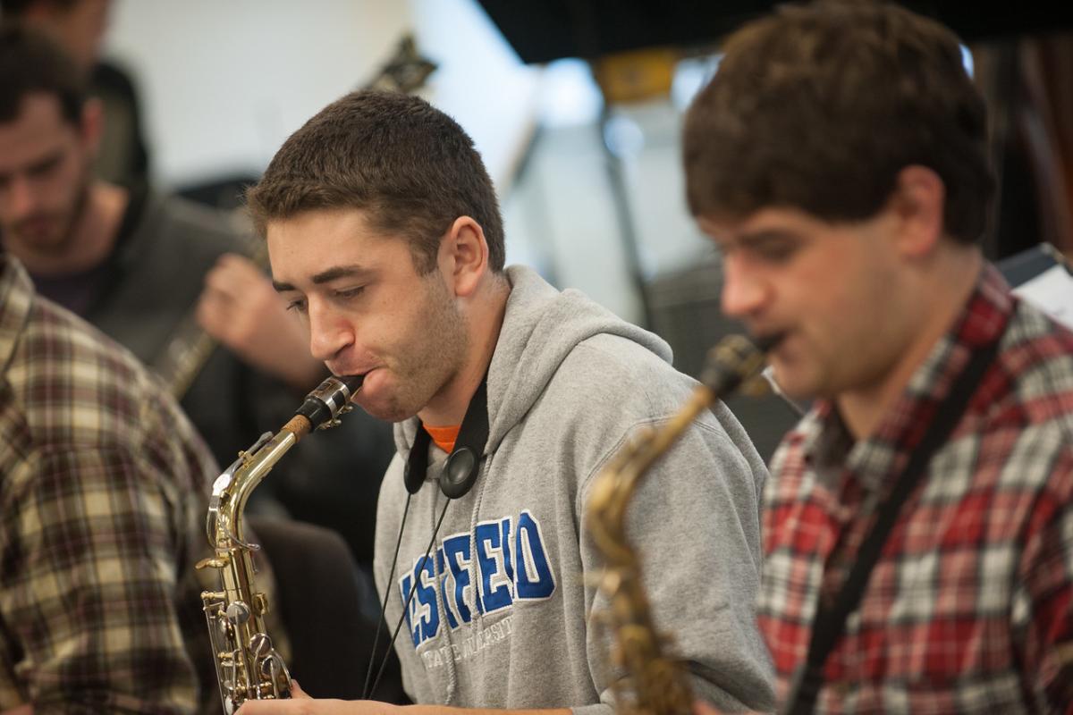 Two Westfield State Music Students perform in the saxophone section of the Westfield State University Big Band