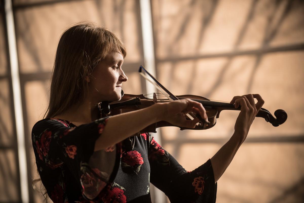 A Westfield State student with her violin