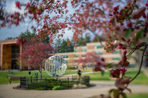 The globe sits on the campus green.