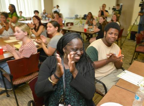 Attendees enjoy the celebration at Elms College for the Western Mass. Literacy Collaborative. (Don Treeger / The Republican)