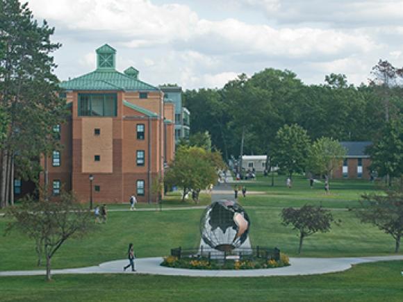 The campus green, with Courtney Hall, as seen from the Ely Campus Center