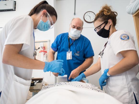 Nursing students work in the sim lab in the Stevens Center