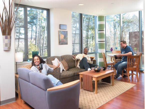 Students gathered in the living room of their New Hall dorm