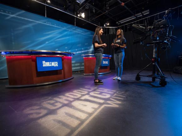 Students on the set of As Schools Match Wits in the Ely Television Studio