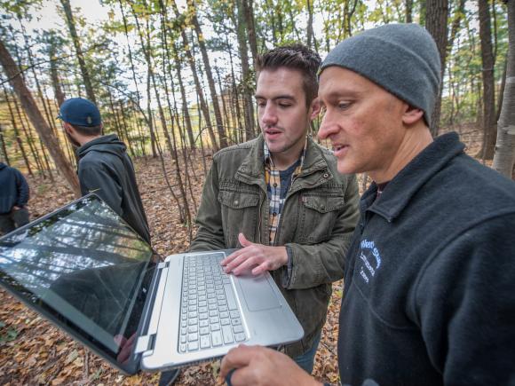 Professor Parshall and student analyze data collected in the field