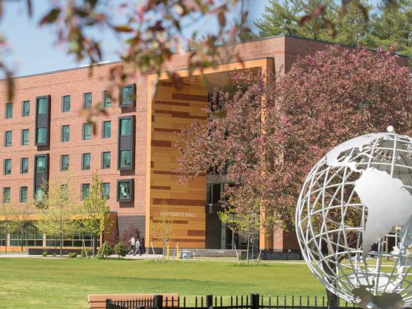 Globe on the campus green with University Hall in the background