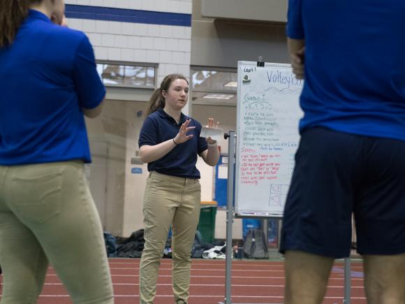 Movement Science student leading a class exercise in the Woodward Center