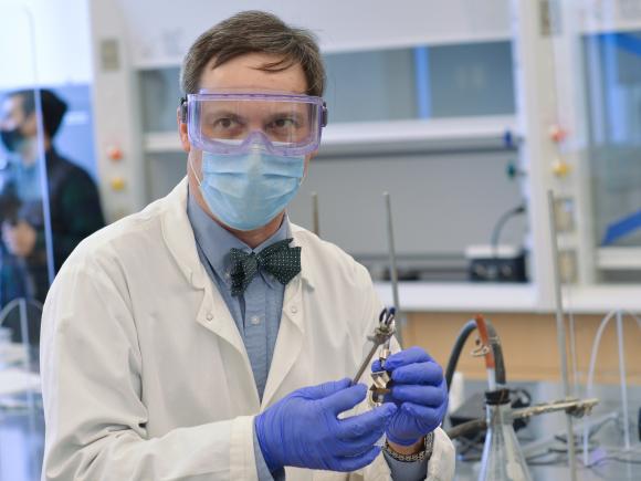 WSU Chemistry professor Dr. Chris Masi in Safety googles and mask in his classroom