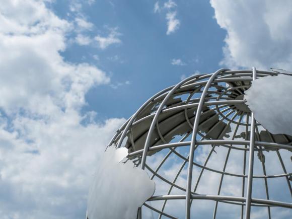 Campus Globe against cloudy blue sky