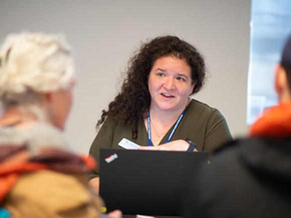 female professor talking to students