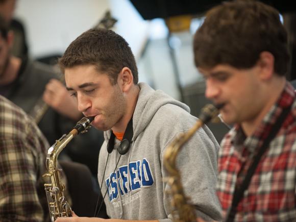 Two Westfield State Music Students perform in the saxophone section of the Westfield State University Big Band