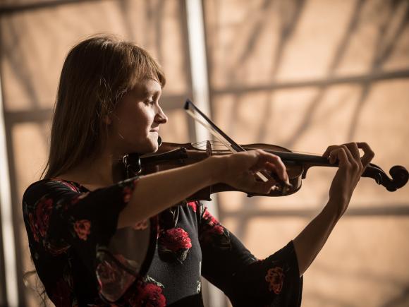 A Westfield State student with her violin