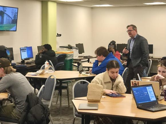 Dr. Nicholas J. Aieta, History and Philosophy Department Chair and Douglass Day Committee member (standing), fields questions during the Mary Ann Shadd Cary transcribe-a-thon, for WSU’s celebration of Douglass Day. (Staff photo)