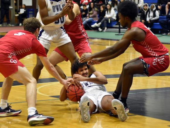 Kobe Parker Basketball Player sits on the basketball court 