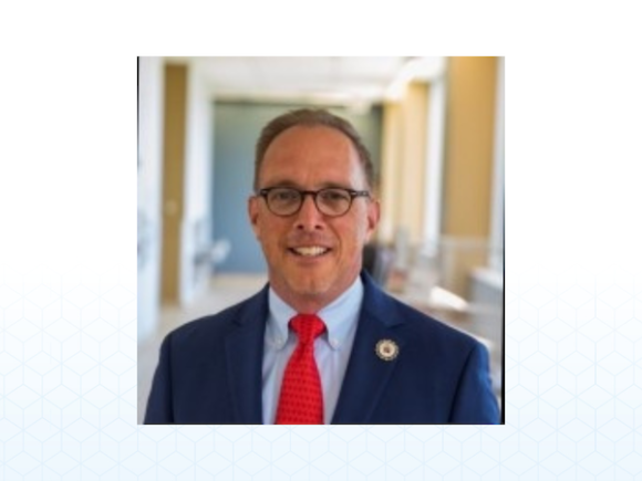 Dr. Kevin Hearn, newly appointed Vice President of Enrollment Management and Student Affairs, smiles at the camera.