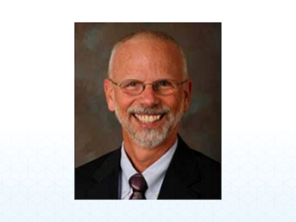 Dr. David Caruso, newly appointed Temporary Provost and Vice President for Academic Affairs, smiles at the camera.