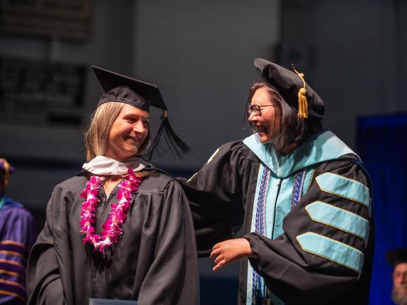 School Counseling student at Commencement with faculty member