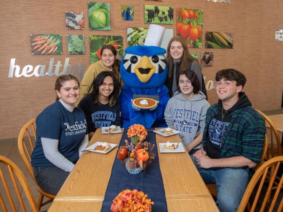 Nestor serves up some pumpkin pie to students for Thanksgiving in the Dining Commons