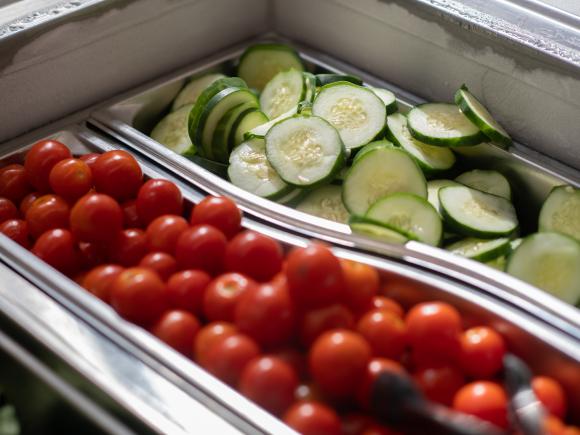 Dining Services fresh cucumbers and cherry tomatoes.