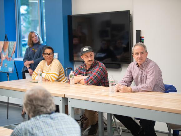 From left, Sheila Coon, of Hot Oven Cookies, Ted Dobek, of Circuit Coffee and Bob Lowry of Bueno Y Sano, speak to students, faculty and staff at the Entrepreneurs of Western Mass panel discussion at the RIDE center on November 6. 