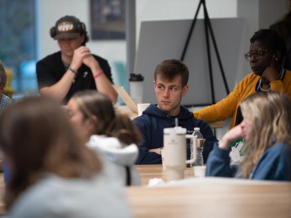 Students listen to local entrepreneurs speak at a panel discussion at the RIDE center on November 6. 