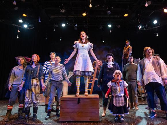 Cast of the theater production Peter & the Starcatcher onstage in the Ely Black Box Theater