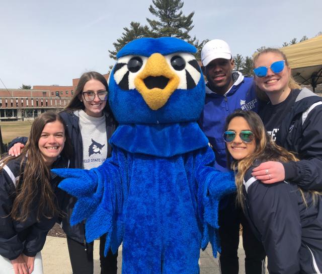 Nestor surrounded by students