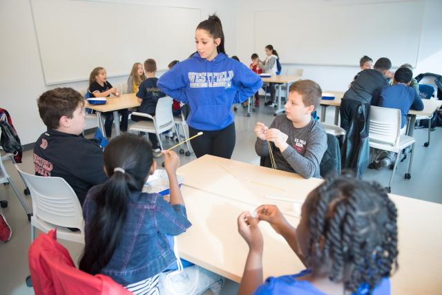 Westfield State student working with local elementary students