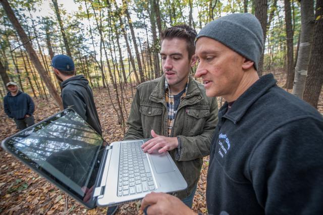 Professor Parshall and student analyze data collected in the field