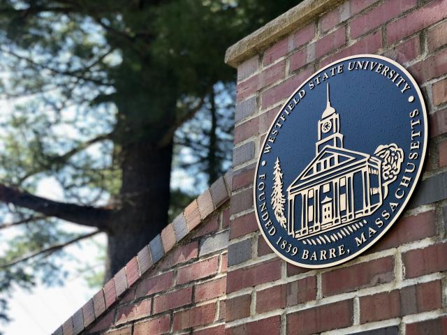 The Westfield State University Seal on the main campus gate