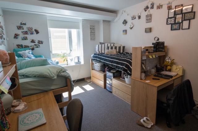 Interior photo of University hall dorm bedroom