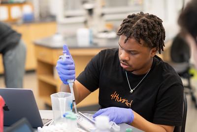 Biology student preparing samples