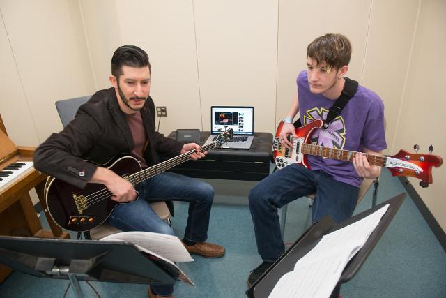 A Westfield State bass instructor with student