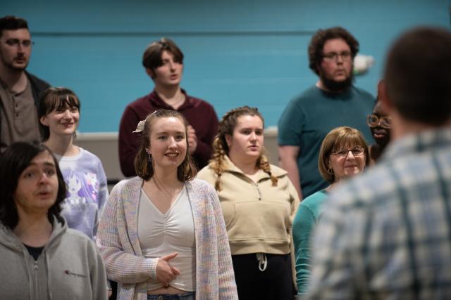 Members of the Westfield State University Chorus rehearse ahead of program on April 23 at the First Congregational Church of Westfield.