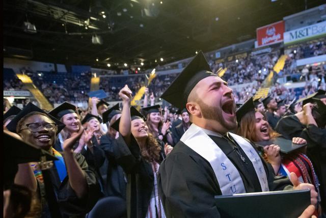 WSU graduates cheer at the end of commencement ceremonies