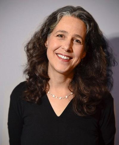 Rachel Gibson smiling wearing black shirt and silver necklace.