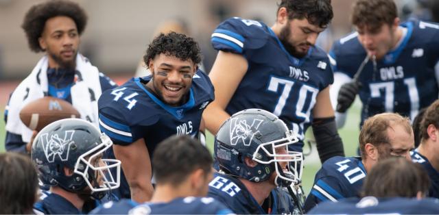 Members of the Westfield State University football team geared up on the field.