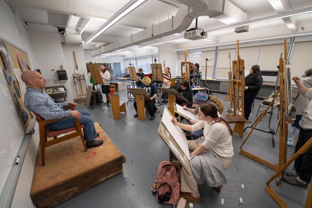 Dower 274 Painting Studio with students in front of easels.