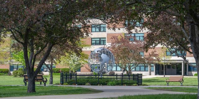 Campus in the spring with pink flowering trees.