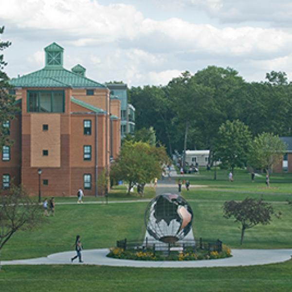 The campus green, with Courtney Hall, as seen from the Ely Campus Center
