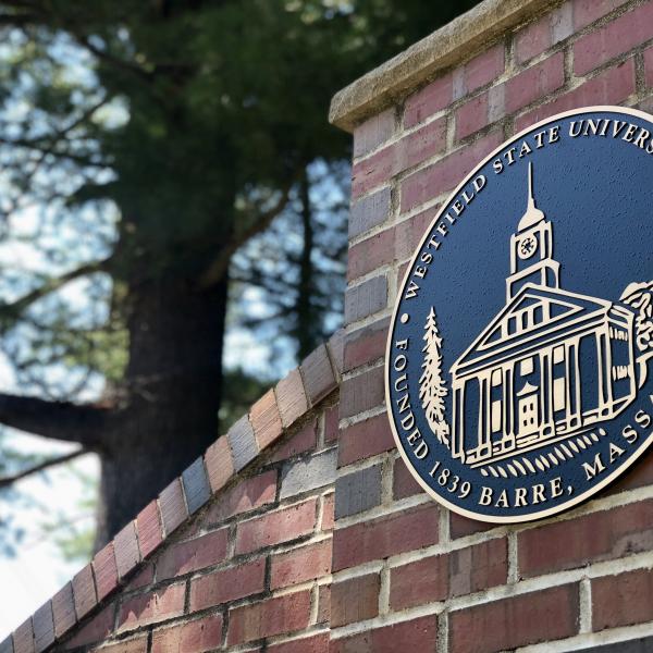 The Westfield State University Seal on the main campus gate