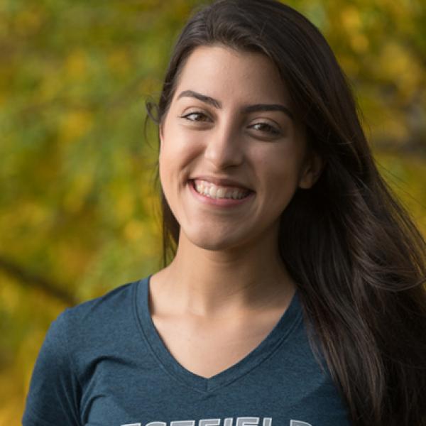 Female student with long brown hair wearing WSU T-shirt