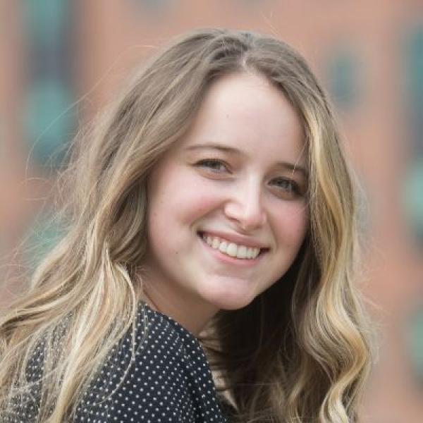 Westfield State University student Kaitlyn Egan smiles while posing for a photograph.