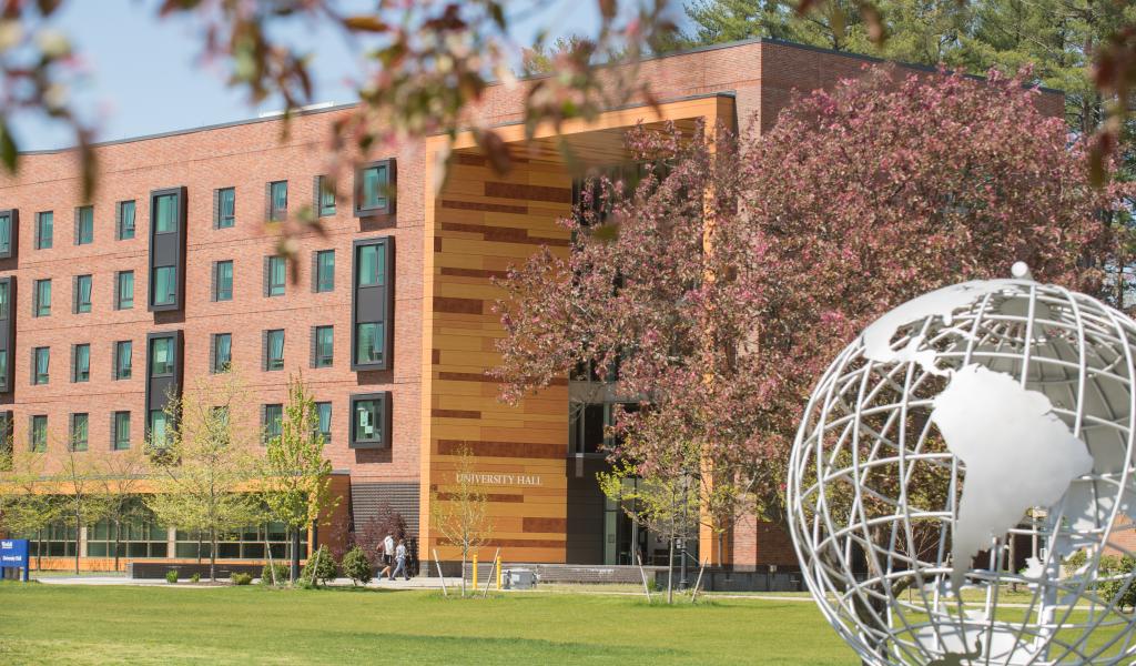 Globe on the campus green with University Hall in the background