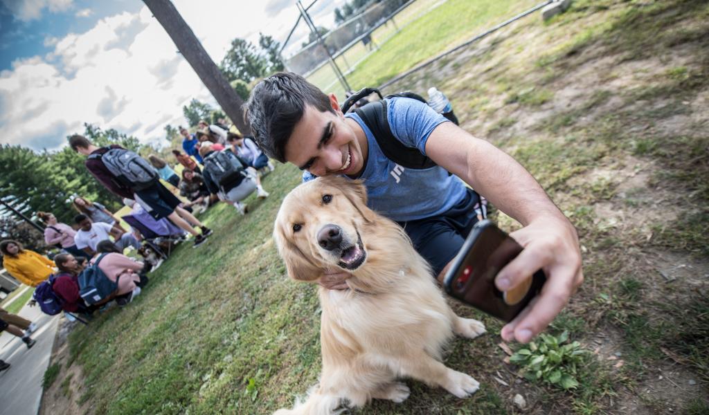 student with dog