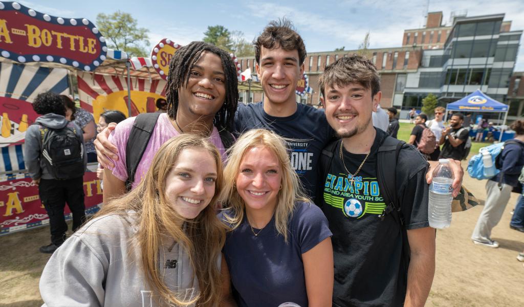 Group of students smiling together at Flight Fest event.