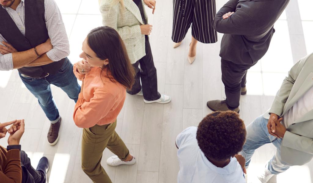 aerial view of people standing and talking 